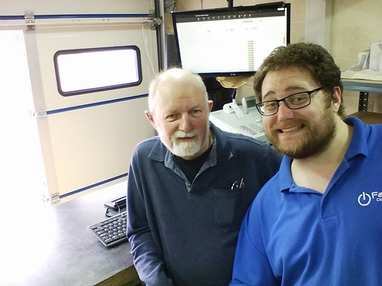 Rob King and his father Paul behind the counter at Fareham Computer Repair.